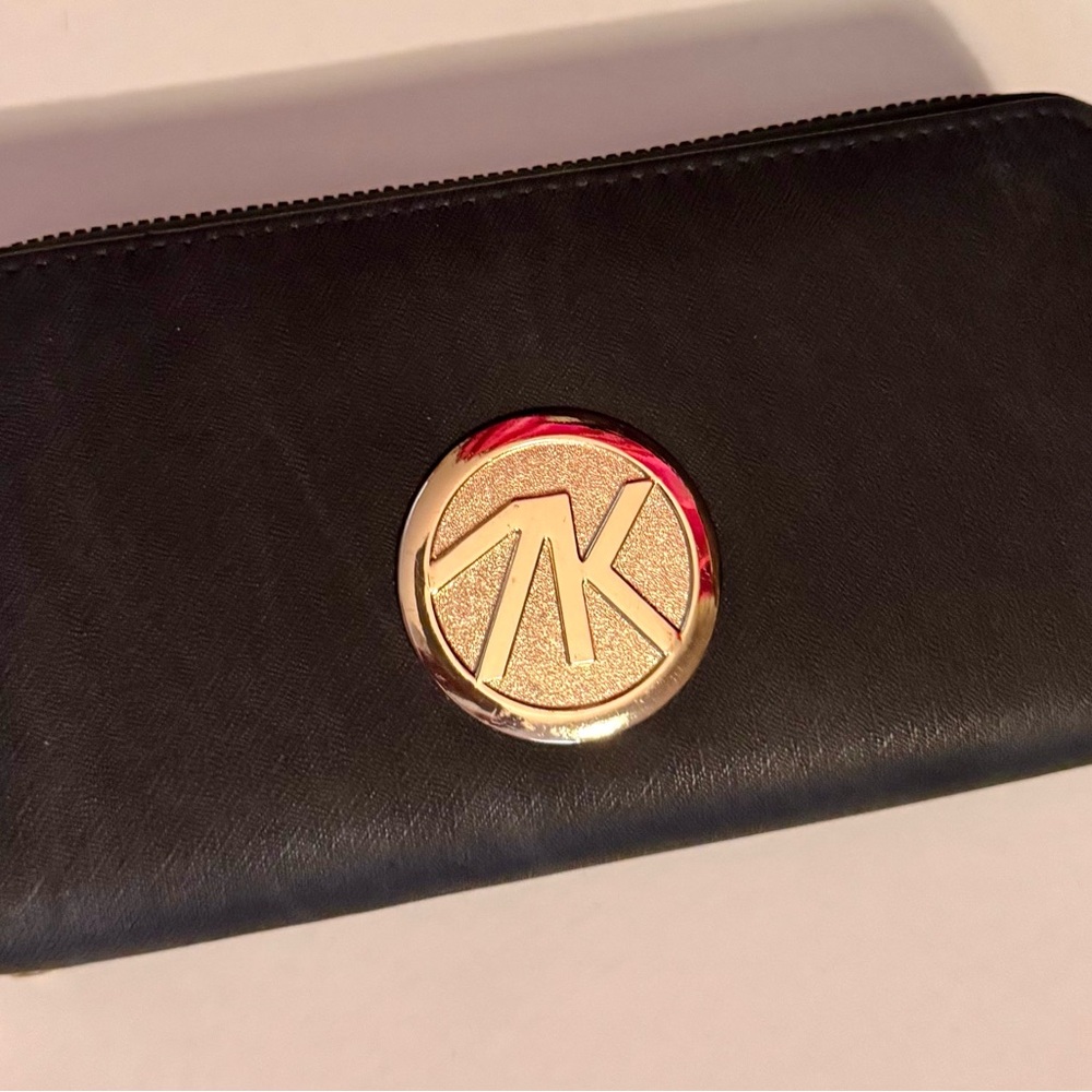 Michael Korr Black Wallet with Gold Logo.